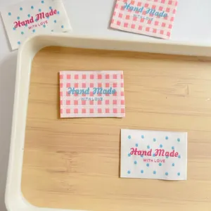 Handmade fabric labels with plaid and polka dot designs, perfect sewing patches for clothes.