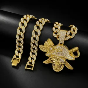 Men gold hip hop pirate skull pendant necklace, iced out cuban link chain jewelry accessory.