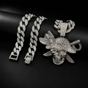 Detailed view of hip hop silver rhinestone pirate skull pendant necklace with cuban link chain.