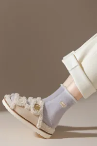 Thick winter warm cotton socks and plush fluffy clogs detail showcasing cozy home wear style.