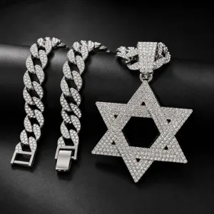 Close-up detail of the iced out rhinestone Star of David pendant and Cuban chain jewelry set.
