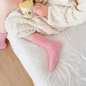 Plush fuzzy cable-knit women winter warm cozy thick sleep socks in pink cozy home wear.