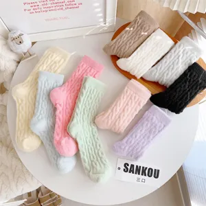 Cozy plush cable knit winter socks for women, warm and soft fuzzy crew socks for home.