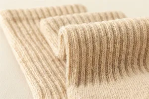 Detailed view of men's winter warm wool socks texture, featuring ribbed elastic and fleece loop sole.