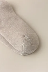 Cozy thick women winter warm cotton socks detail shot, soft knitted thermal hosiery item.