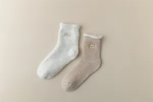Detailed view of women thick fleece lined thermal winter socks with sweet embroidery design.