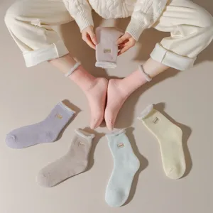 Women thick thermal fleece-lined winter cozy mid-tube socks for indoor floor and sleep.