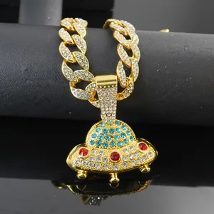 Detailed shot of the iced out Cuban chain with a UFO pendant, hip hop style gold necklace.