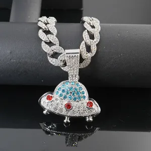 Detailed shot of a rhinestone cuban link chain with a sparkling UFO pendant necklace for men.