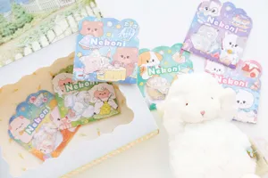 NEKONI laser cute animal daily life sticker packs with plush lamb toy for journaling and crafts.
