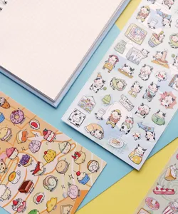 Cute cartoon cow and dessert decorative PVC planner stickers with grid notebook, detail view.