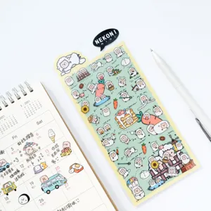 Detailed close-up view of cute sheep PVC journal stickers sheet with calendar and white pen prop.