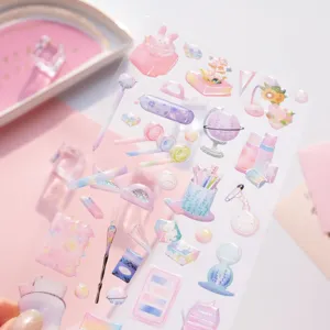 Cute holographic epoxy stationery stickers sheet featuring dreamy globes, books and pens.