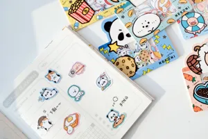 Cute cartoon animal sticker detail view, creative journaling decoration and planner flatlay.