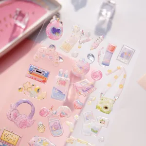 Cute aesthetic clear epoxy sticker sheet detail featuring cute retro items and close up view.