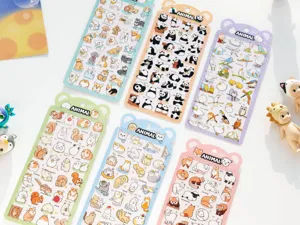 Detail view of cute animal sticker sheets set featuring adorable pets and pandas for diary decor.