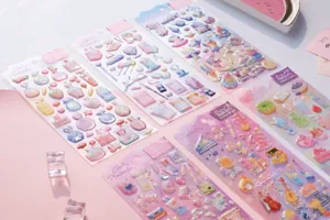 Epoxy journal stickers detail view, featuring cute space cats and dessert designs.