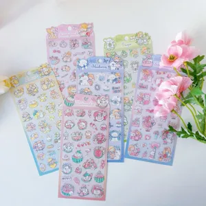 Close-up detail of cute cartoon animal and fruit PVC decorative stickers for journals and cups.