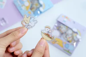 Cute transparent decorative journaling stickers with gold foil details, perfect for crafts.