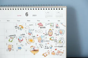 Cute cartoon rabbit and duck decorative journal stickers displayed on a monthly calendar page.