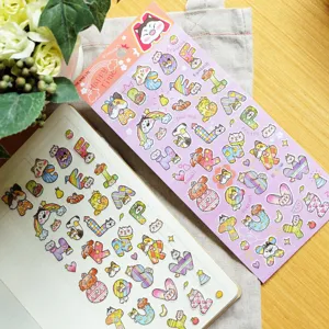 Detailed view of cute cat and dog alphabet stickers, perfect for journal and phone decoration.