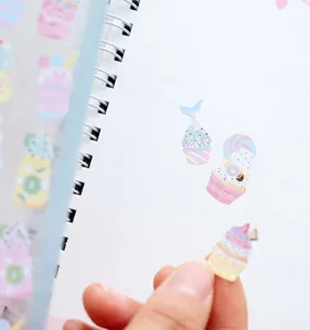 Cute macaron illustration paper journaling stickers detail view showing lovely cupcake patterns.