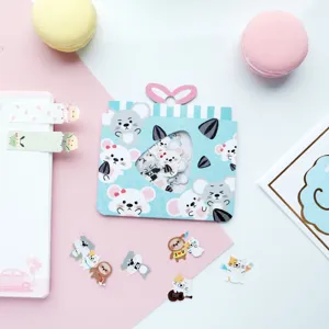 Detail view of cute animal granule stickers and journal decoration pieces for crafts.