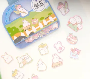 Cute rabbit sticker pack featuring 12 unique cartoon designs for DIY journaling and crafts.