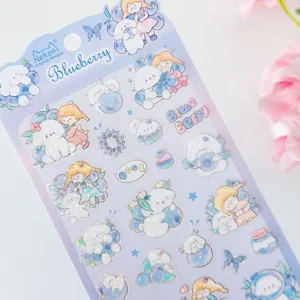 Close-up detail of cute blueberry puppy holographic sticker sheet for journaling and cup decor.