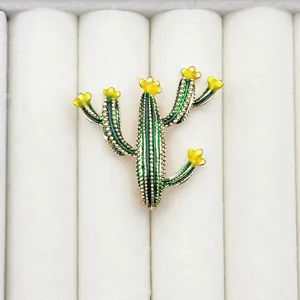 Detailed view of the cute enameled cactus brooch pin, perfect for suit accessories.