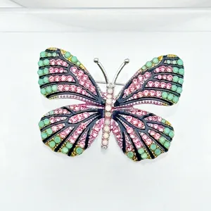 Exquisite rhinestone butterfly brooch pin, elegant fashion apparel accessory for women.