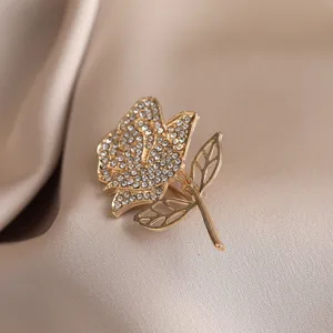 Elegant rhinestone rose brooch pin for women, luxury crystal lapel accessory for coat.