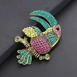 Rhinestone parrot brooch pin for women, colorful crystal alloy bird corsage clothing decor.