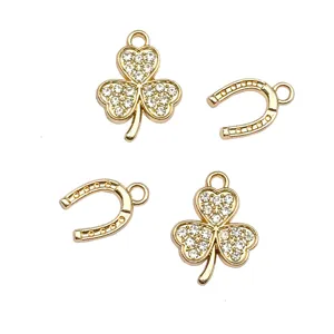 Gold alloy rhinestone clover and horseshoe DIY charms for handmade jewelry making.