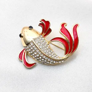 Exquisite koi fish brooch detail, featuring sparkling rhinestones and red enamel.