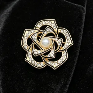 Vintage camellia brooch with sparkling rhinestones and pearl for elegant women suits.