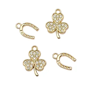 Gold alloy rhinestone clover and horseshoe charms for DIY handmade jewelry necklace making.