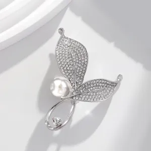 Detailed view of elegant silver rhinestone brooch with pearls for women fashion accessories