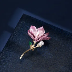 Exquisite enamel flower pearl brooch, elegant gold tone botanical pin for women apparel.