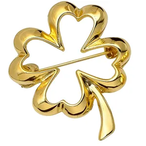 Gold hollow four-leaf clover brooch detail shot, elegant metallic shine fashion accessory pin.