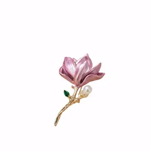 Exquisite camellia flower enamel brooch for women with pearl and gold stem detail.