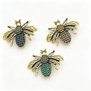 Vintage gold tone rhinestone bee brooch set, elegant insect lapel pins for clothing decor.