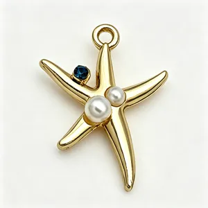 Gold-plated starfish pendant charm with pearls and blue crystal for DIY jewelry making detail.