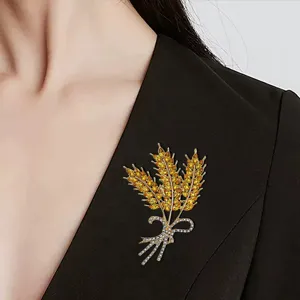 Elegant golden wheat ear brooch with sparkling crystals, perfect for coats, suits, and daily wear.