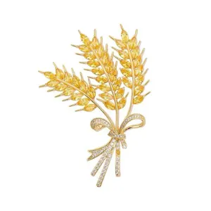 Elegant gold wheat ear brooch with yellow crystal stones and pavé bow design for women outerwear.