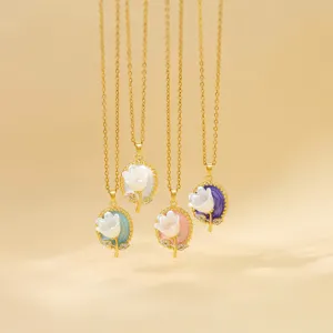 French vintage style gold necklace with colorful enamel flower pendant and delicate chain.
