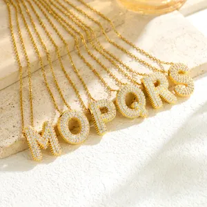 Gold initial bubble letter necklaces paved with sparkling cubic zirconia, fashion jewelry.