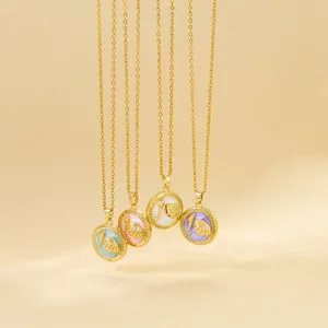 French vintage style enamel pendant necklace set with colorful seashell charms on gold chains.