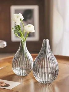 Nordic style clear ribbed glass vase set, elegant striped design for home decor detail.