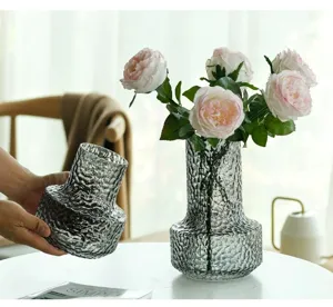 Detailed view of luxury textured grey glass vase showcasing unique ice cracked surface design.